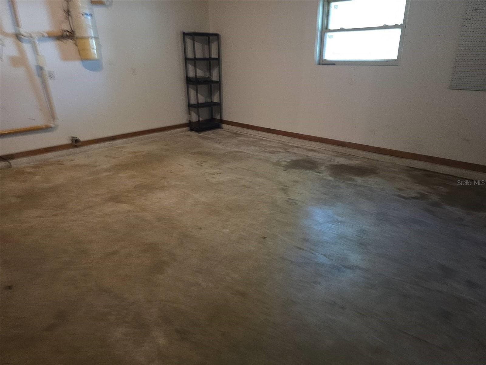 Attached garage interior - 1008 LYNBROOK ST NW, PALM BAY