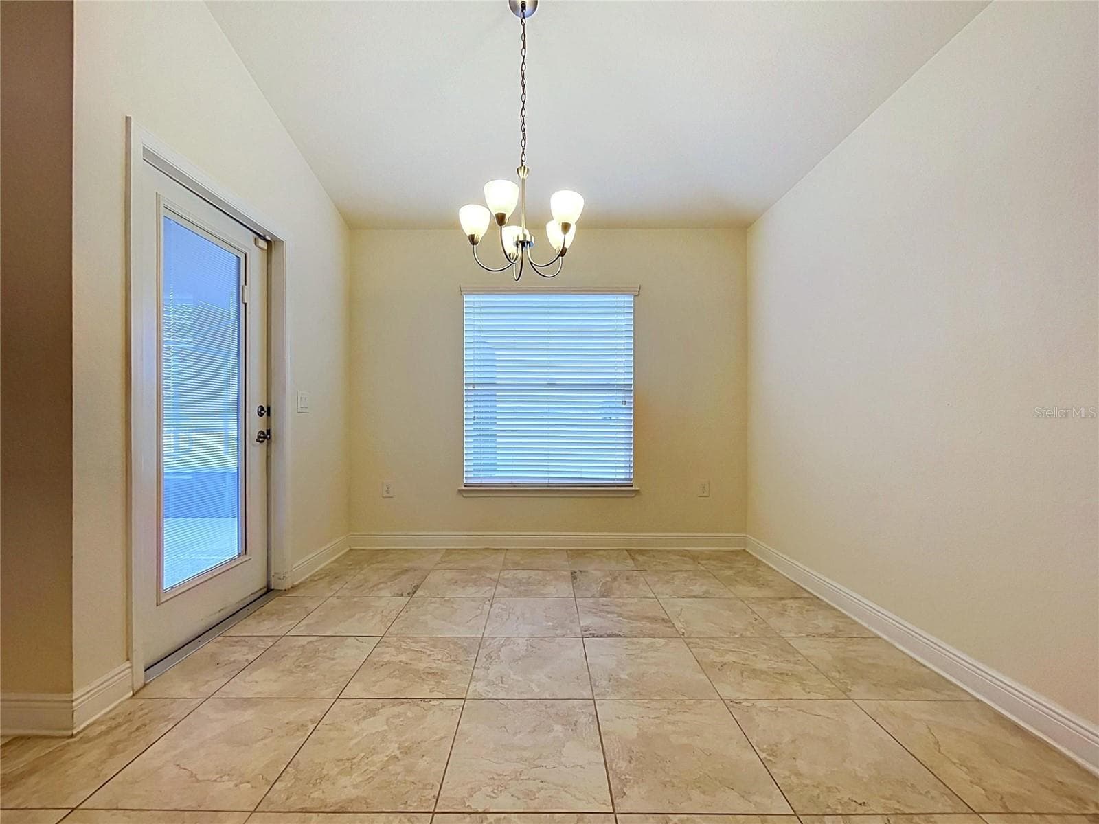 DINING AREA WITH DOOR TO BACK PATIO - 7029 WIREVINE DR, BROOKSVILLE