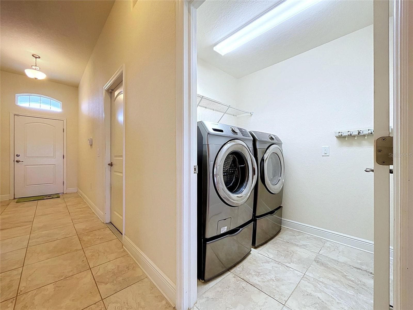 FOYER AND LAUNDRY ROOM - 7029 WIREVINE DR, BROOKSVILLE