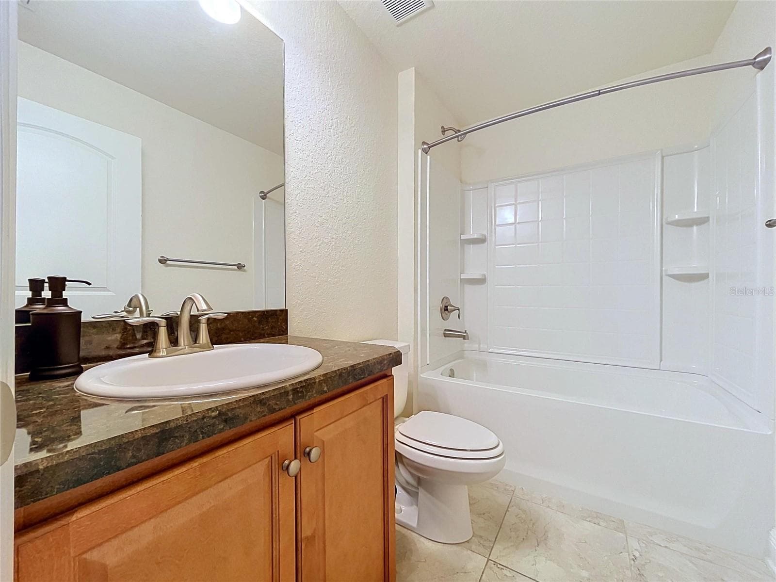 GUEST BATHROOM WITH SHOWER AND TUB - 7029 WIREVINE DR, BROOKSVILLE