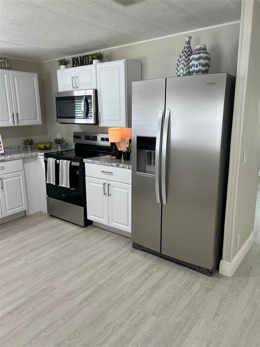 Manufactured Home at 529 NEEDLE PALM ST, LARGO, photo 10 of 32