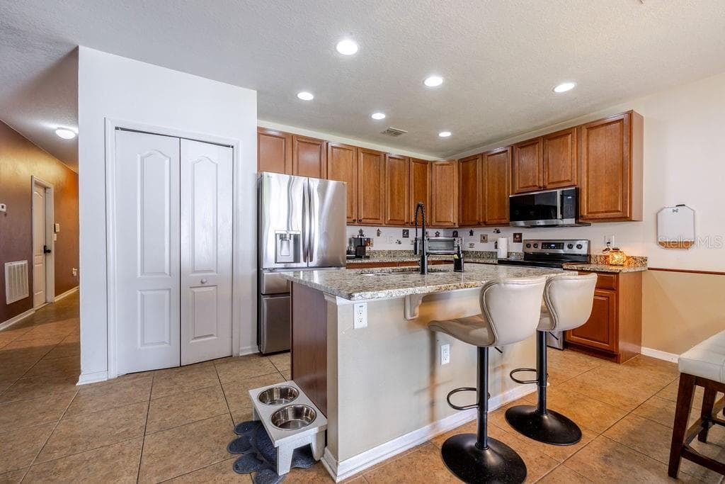 Kitchen breakfast bar and pantry - 252 SHERRI LEE LN, DELAND