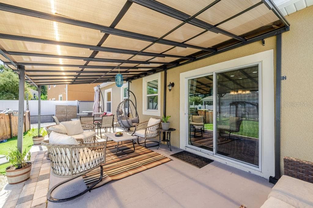 Covered back paver patio - 252 SHERRI LEE LN, DELAND