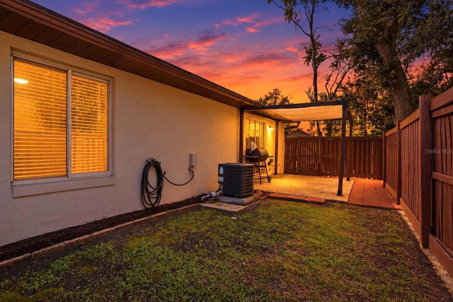 Twilight backyard view - 167 CLEAR LAKE CIR, SANFORD