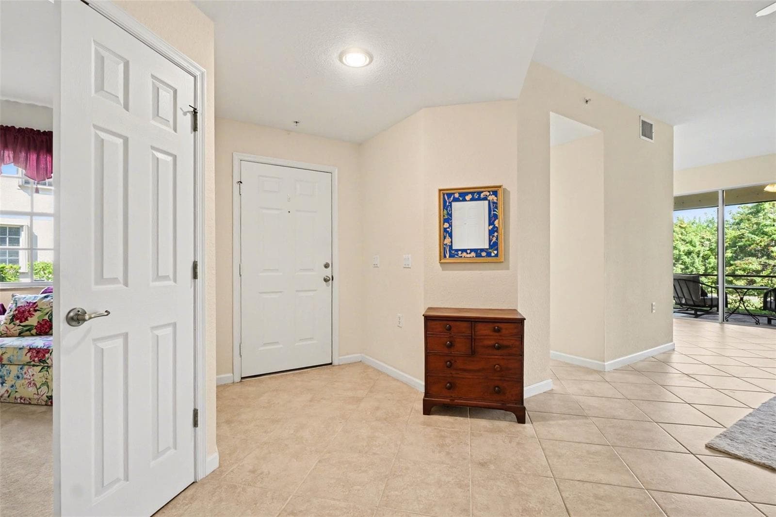 Side entryway provides a view of the great room - 4683 CLUB DR #101, PORT CHARLOTTE