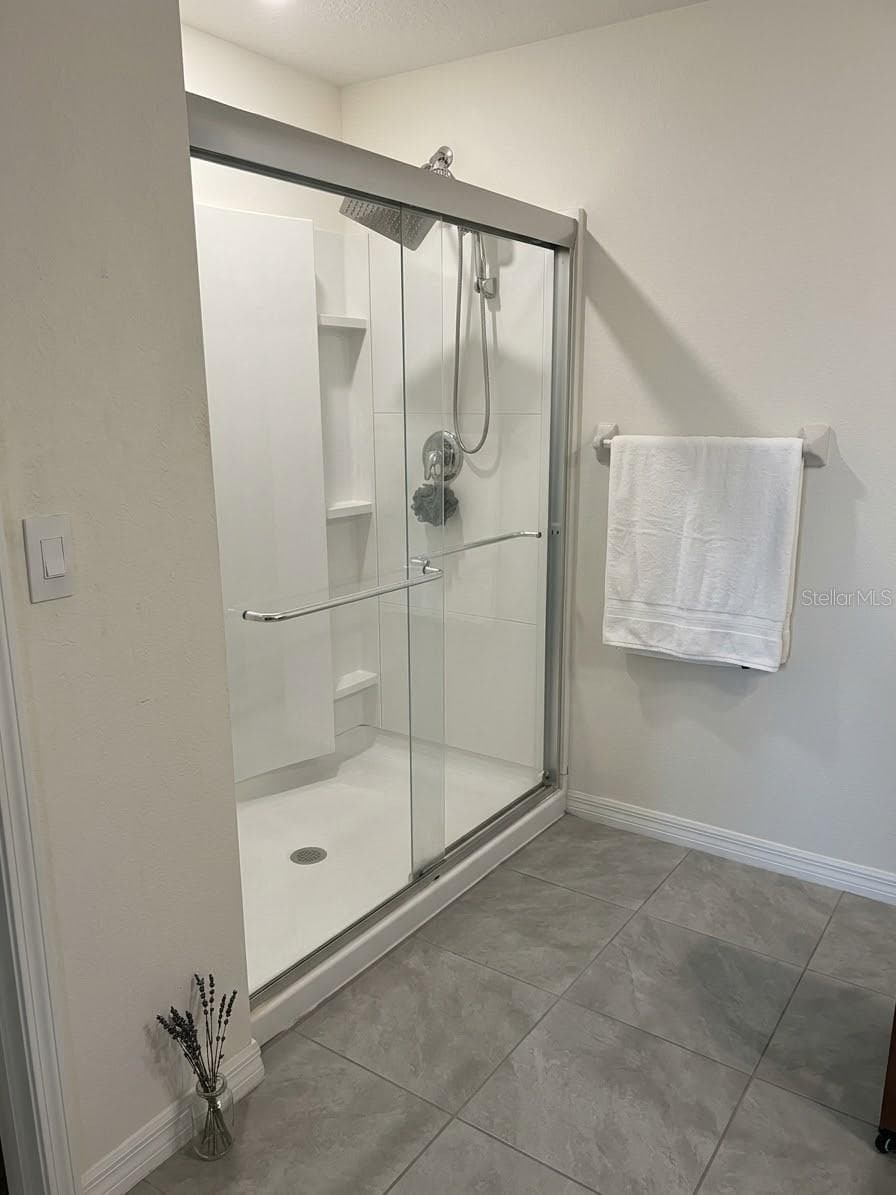 Primary glass-enclosed walk-in shower - 5058 GRANITE DUST PL, PALMETTO