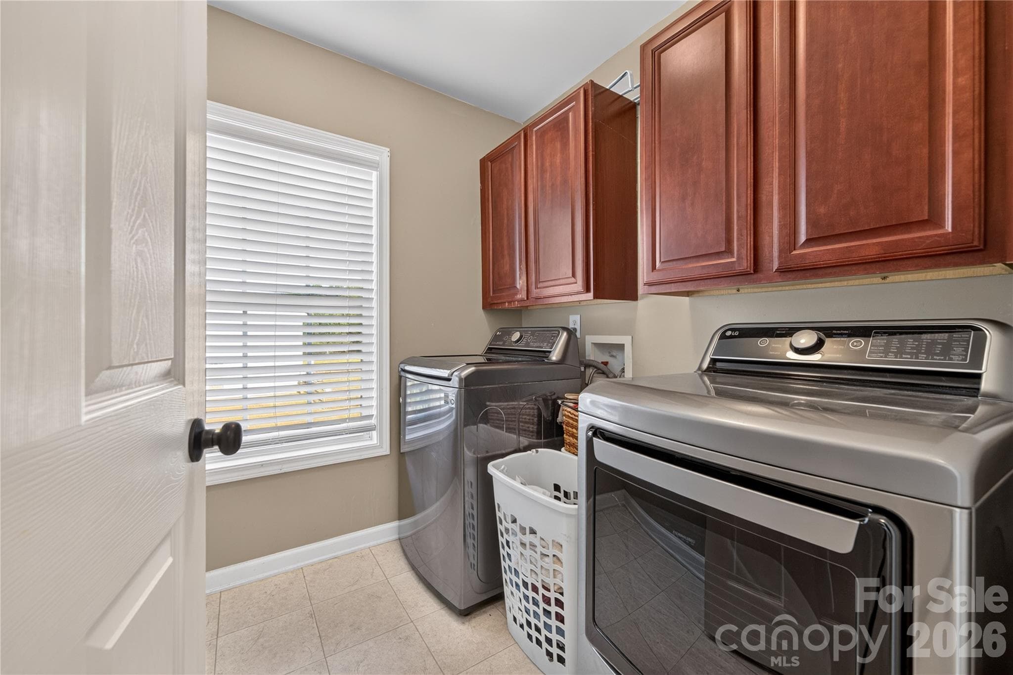 Laundry room with cabinetry for storage - 5725 Lindley Crescent Drive, Indian Trail
