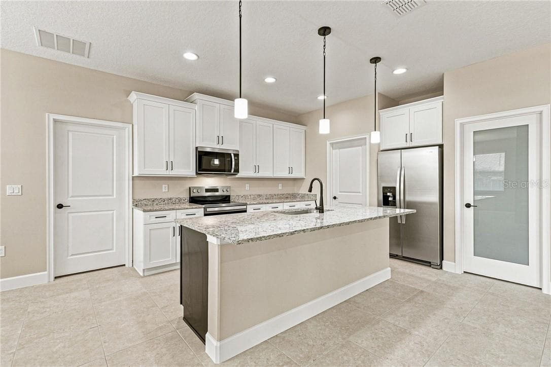 Full Kitchen View with Garage and Laundry Room doors - 2171 Fallon BLVD NE, PALMBAY FL 32907, Palm Bay