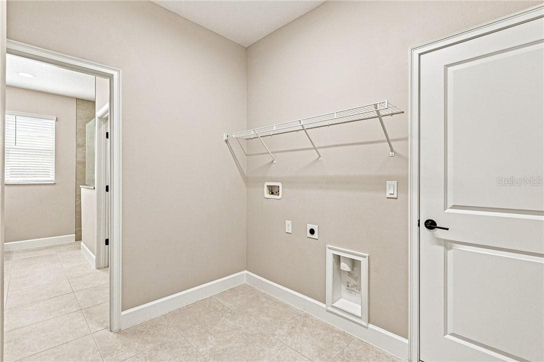 In home Laundry room with washer and electric dryer hookup - 2171 Fallon BLVD NE, PALMBAY FL 32907, Palm Bay