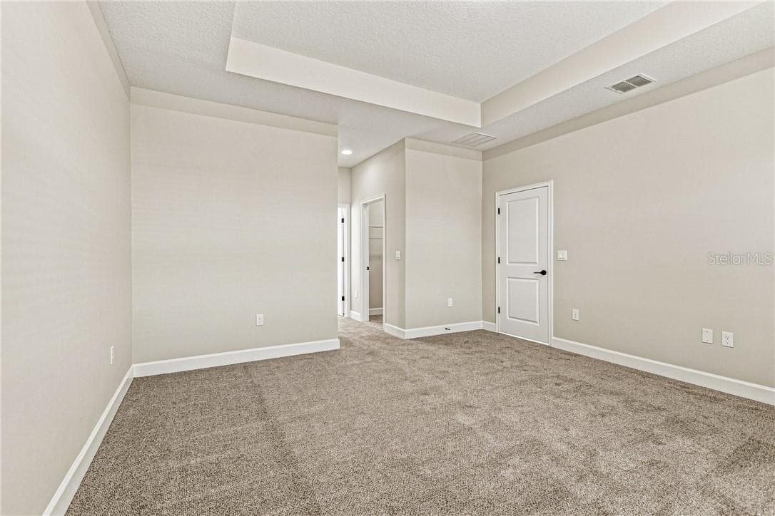 Primary Bedroom with Tray ceilings and carpet for added comfort - 2171 Fallon BLVD NE, PALMBAY FL 32907, Palm Bay