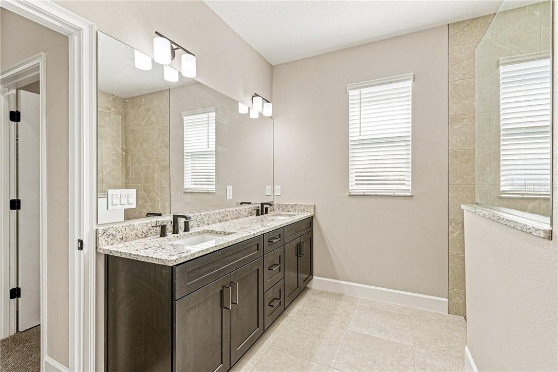 Primary bathroom with dual sinks and walk in shower - 2171 Fallon BLVD NE, PALMBAY FL 32907, Palm Bay