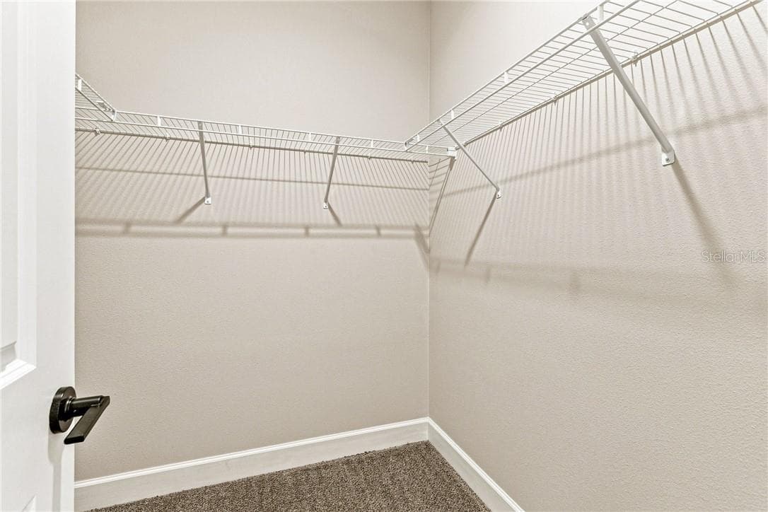 Primary bedroom walk in closet - 2171 Fallon BLVD NE, PALMBAY FL 32907, Palm Bay