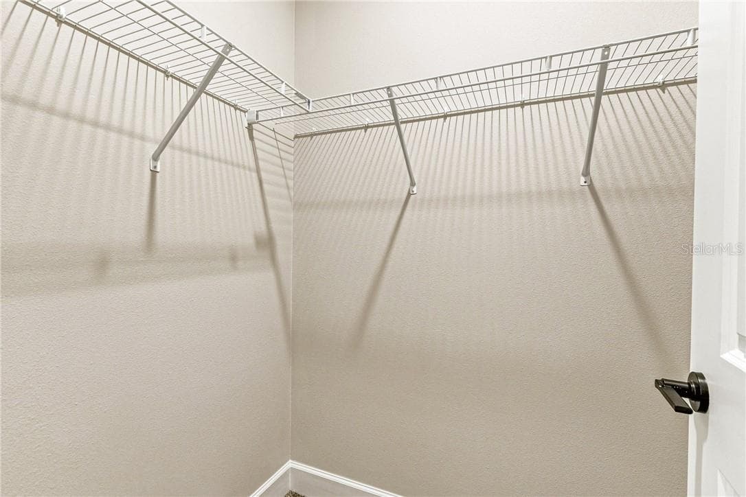 Primary bedroom walk in closet - 2171 Fallon BLVD NE, PALMBAY FL 32907, Palm Bay