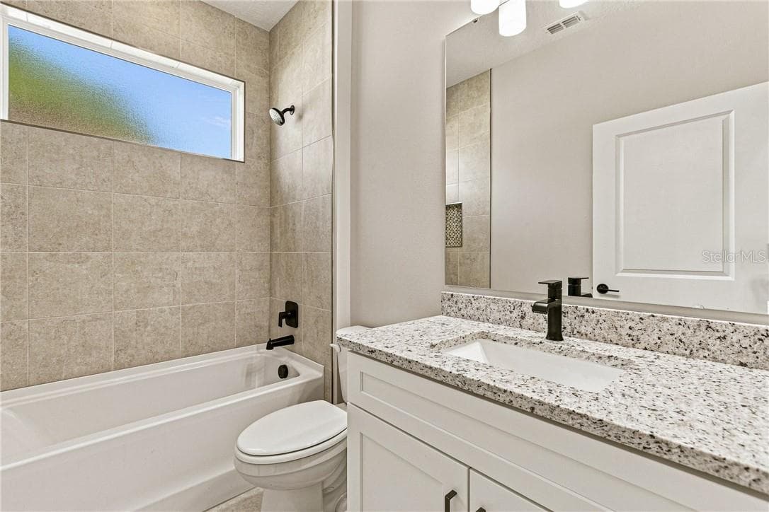 Bathroom 2, shower with tub and granite countertops - 2171 Fallon BLVD NE, PALMBAY FL 32907, Palm Bay