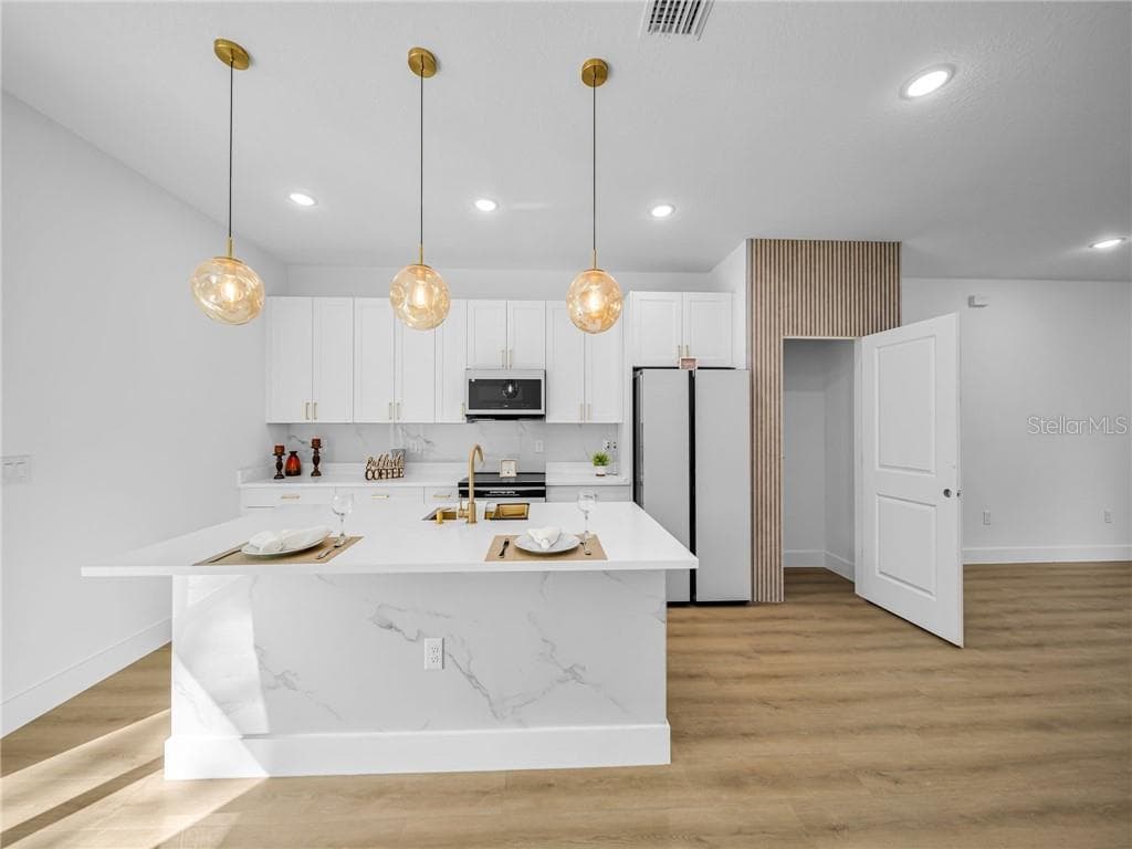 Kitchen with Island and Modern Cabinetry - 6664 N Bedstrow BLVD, CITRUSSPRINGS FL 34434, Citrus Springs