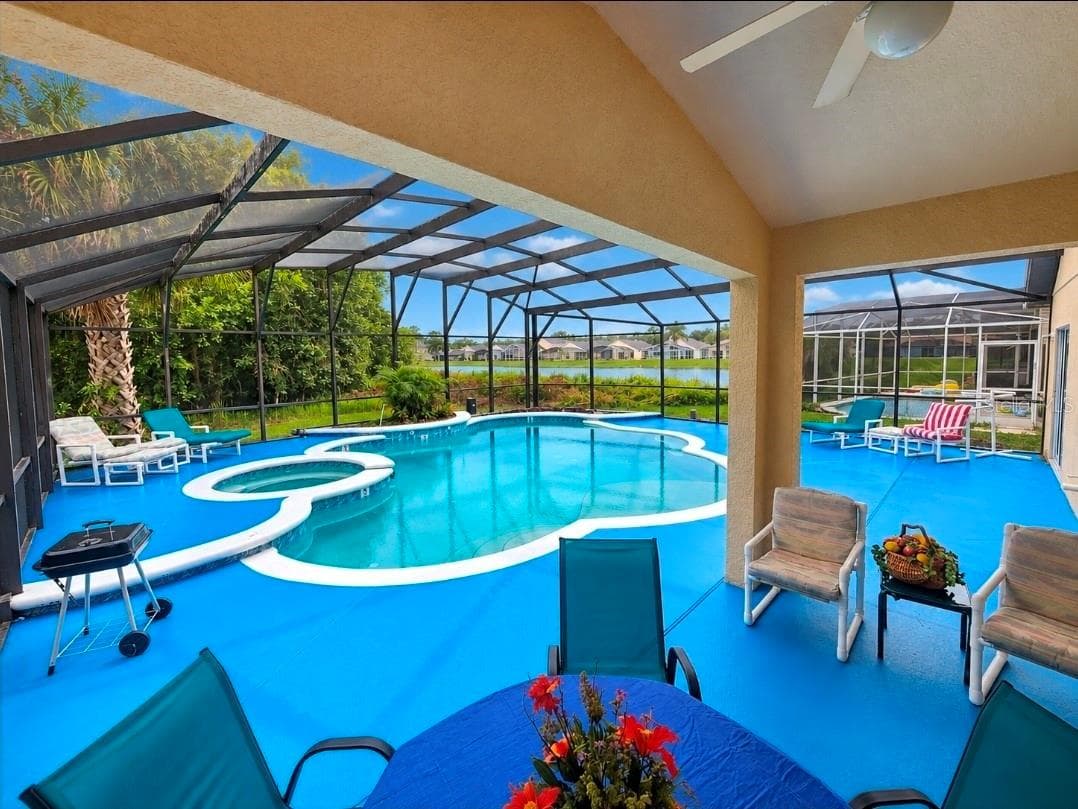 COVERED LANAI/ SEATING AREA TABLE + 2 CHAIRS - 4640 EAGLE PEAK DR, KISSIMMEE