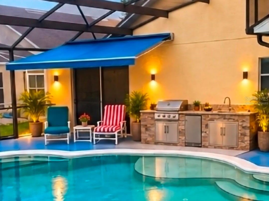 SUMMER KITCHEN AND AWNING OFF MASTER VIRTUALLY STAGED - 4640 EAGLE PEAK DR, KISSIMMEE
