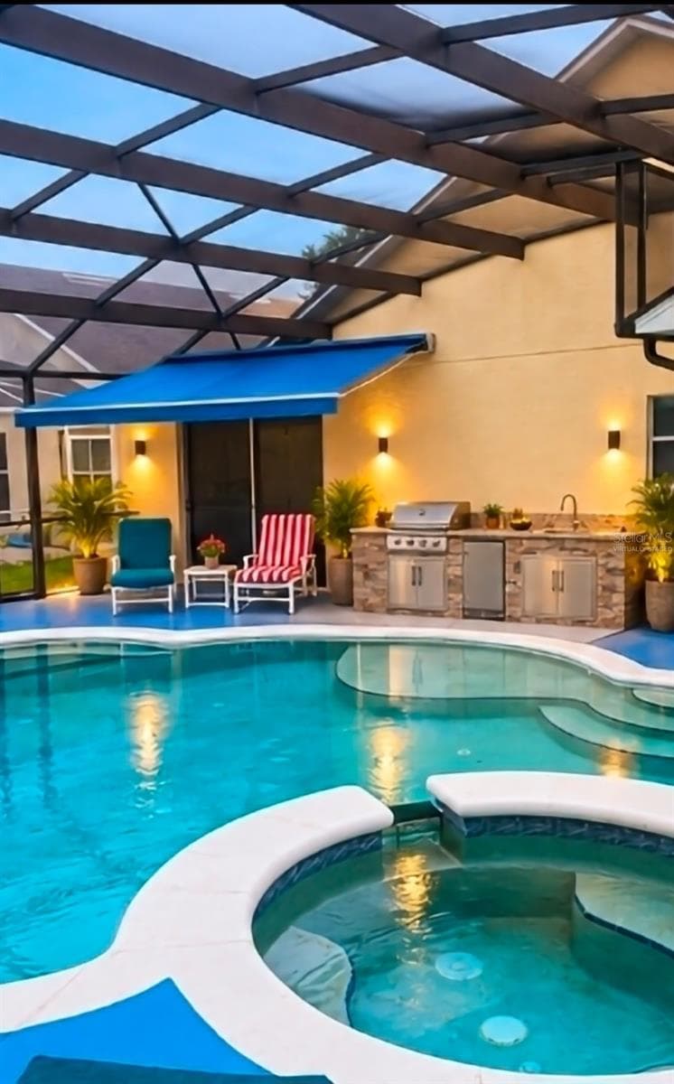 SUMMER KITCHEN AND AWNING OFF MASTER VIRTUALLY STAGED - 4640 EAGLE PEAK DR, KISSIMMEE