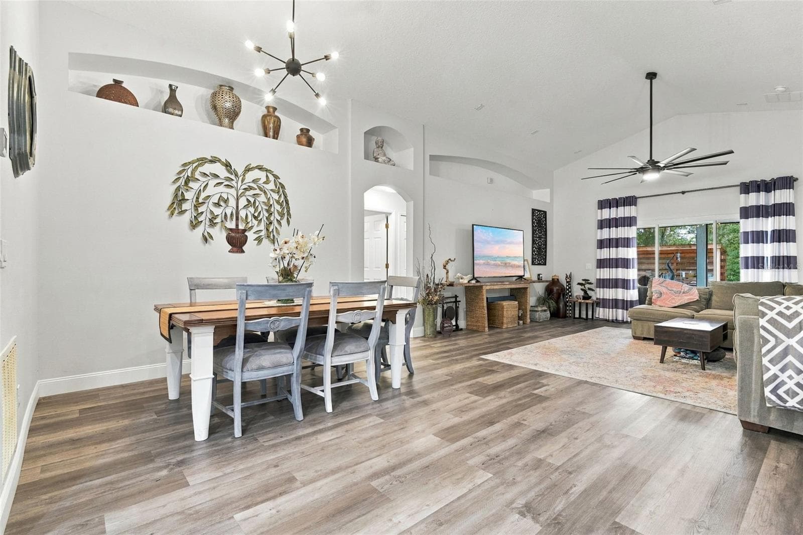 Dining and main living area. These soaring ceilings make it feel larger than it is. - 430 DEANNA CIR, DELAND