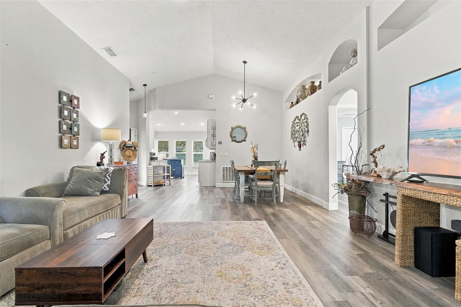 Main living area towards dining area. These ceilings are so nice! - 430 DEANNA CIR, DELAND