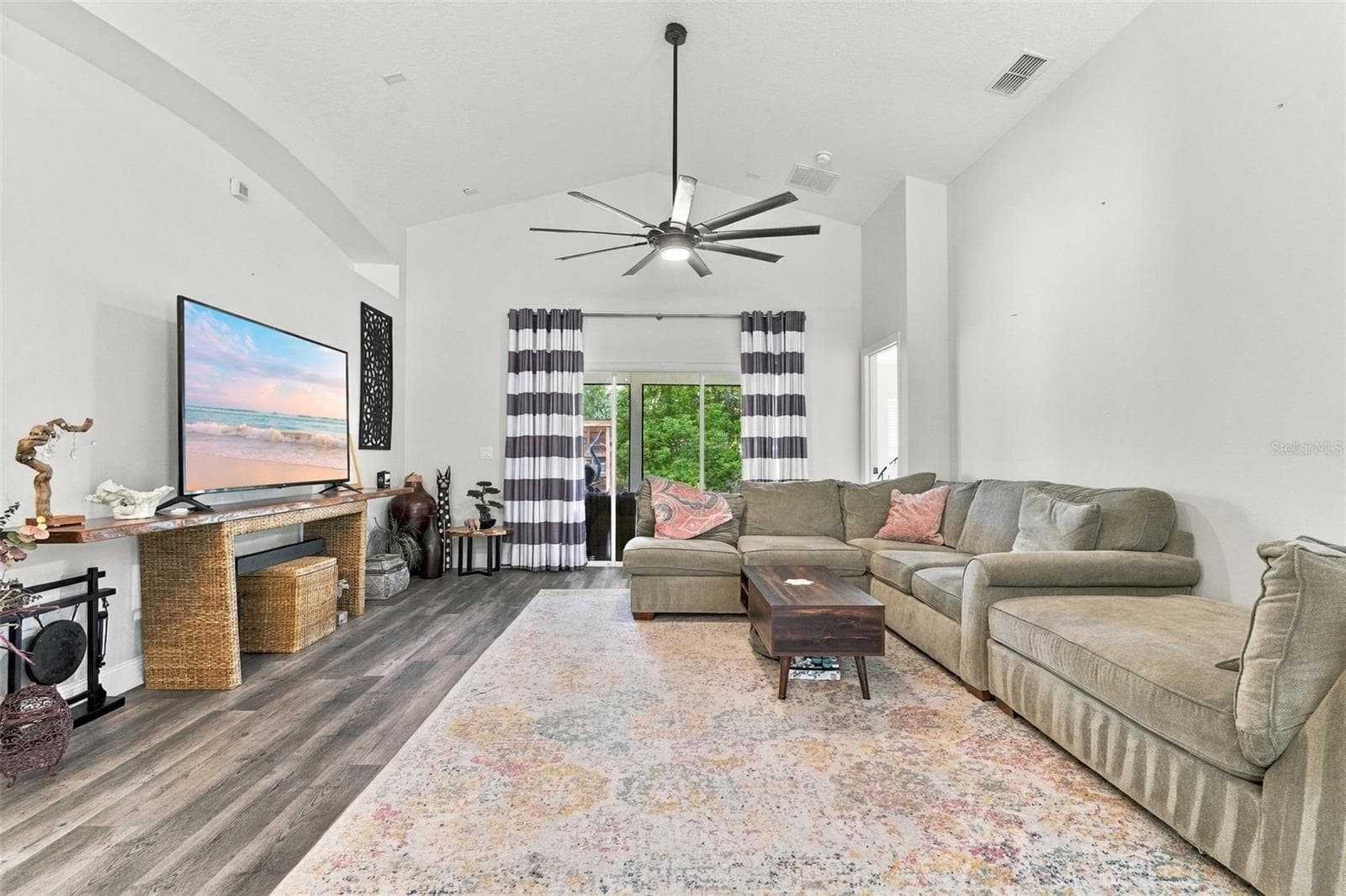 Main living area towards large screened porch. - 430 DEANNA CIR, DELAND