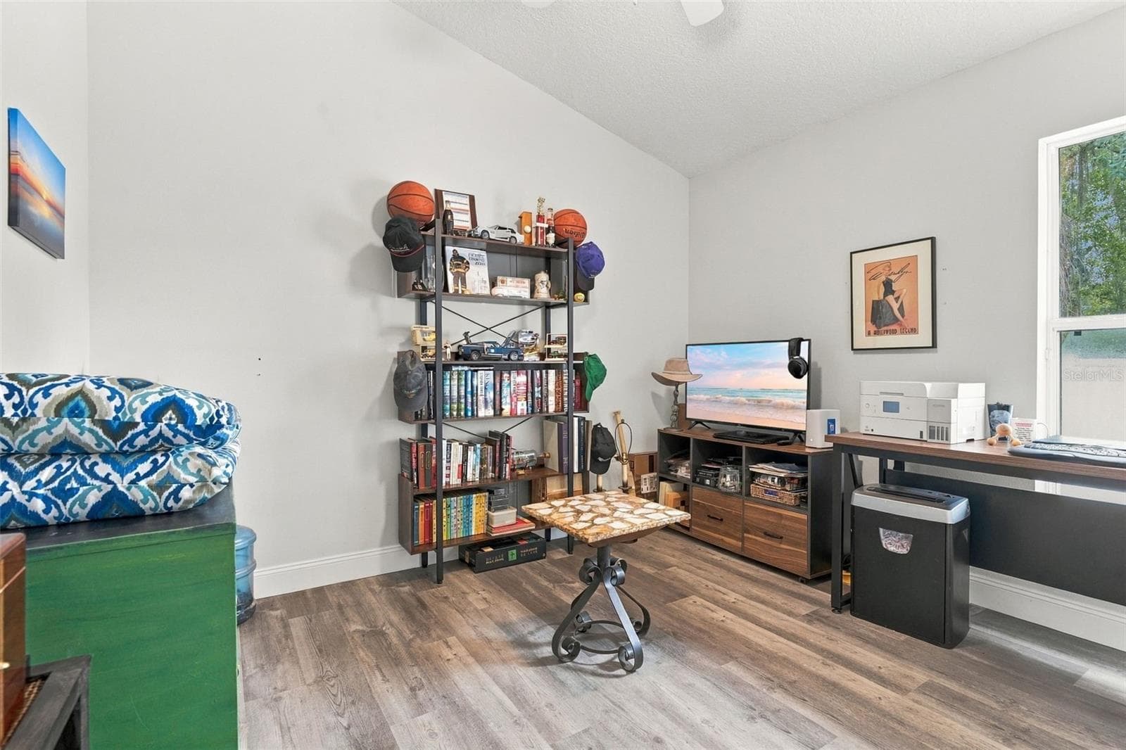 This front bedroom is currently being utilized as an office space. - 430 DEANNA CIR, DELAND