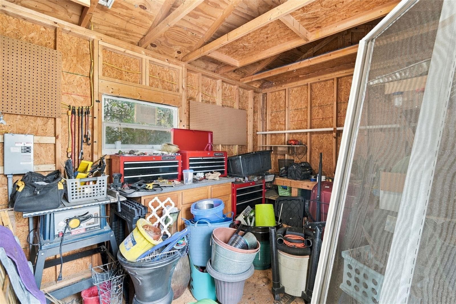 Interior of large shed/workshop with electric. - 430 DEANNA CIR, DELAND