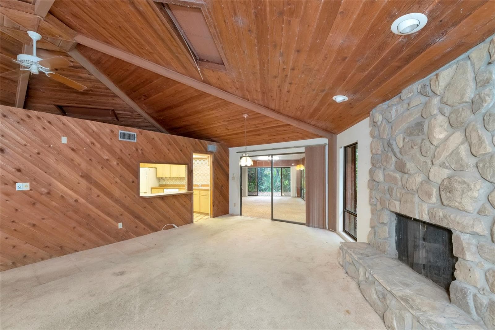Wood Burning Fireplace in the Living/Dining Room. - 4781 STONE RIDGE TRL, SARASOTA