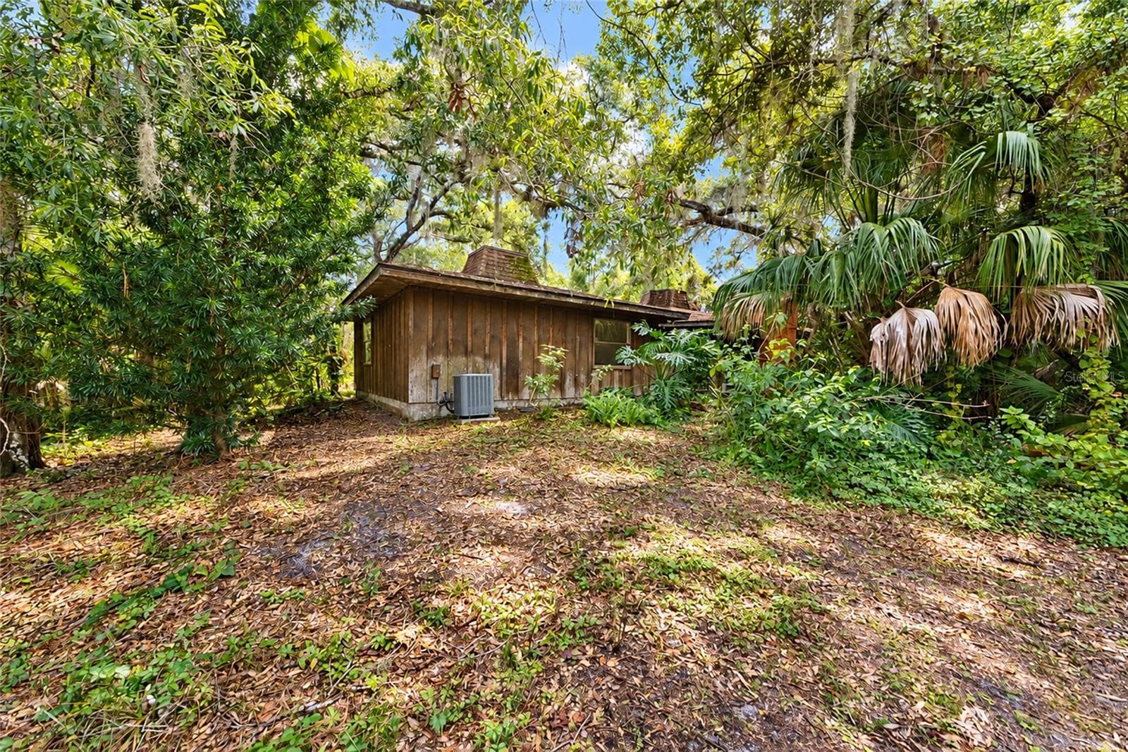 Right Side of House from the Back. Note the Second Unit for the Two Zone Air Conditioner. - 4781 STONE RIDGE TRL, SARASOTA