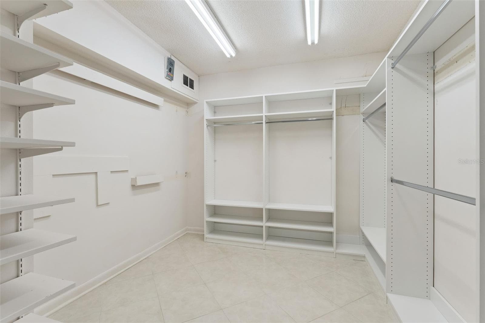 Primary room walk in closet - 221 PINE CONE LN, LONGWOOD