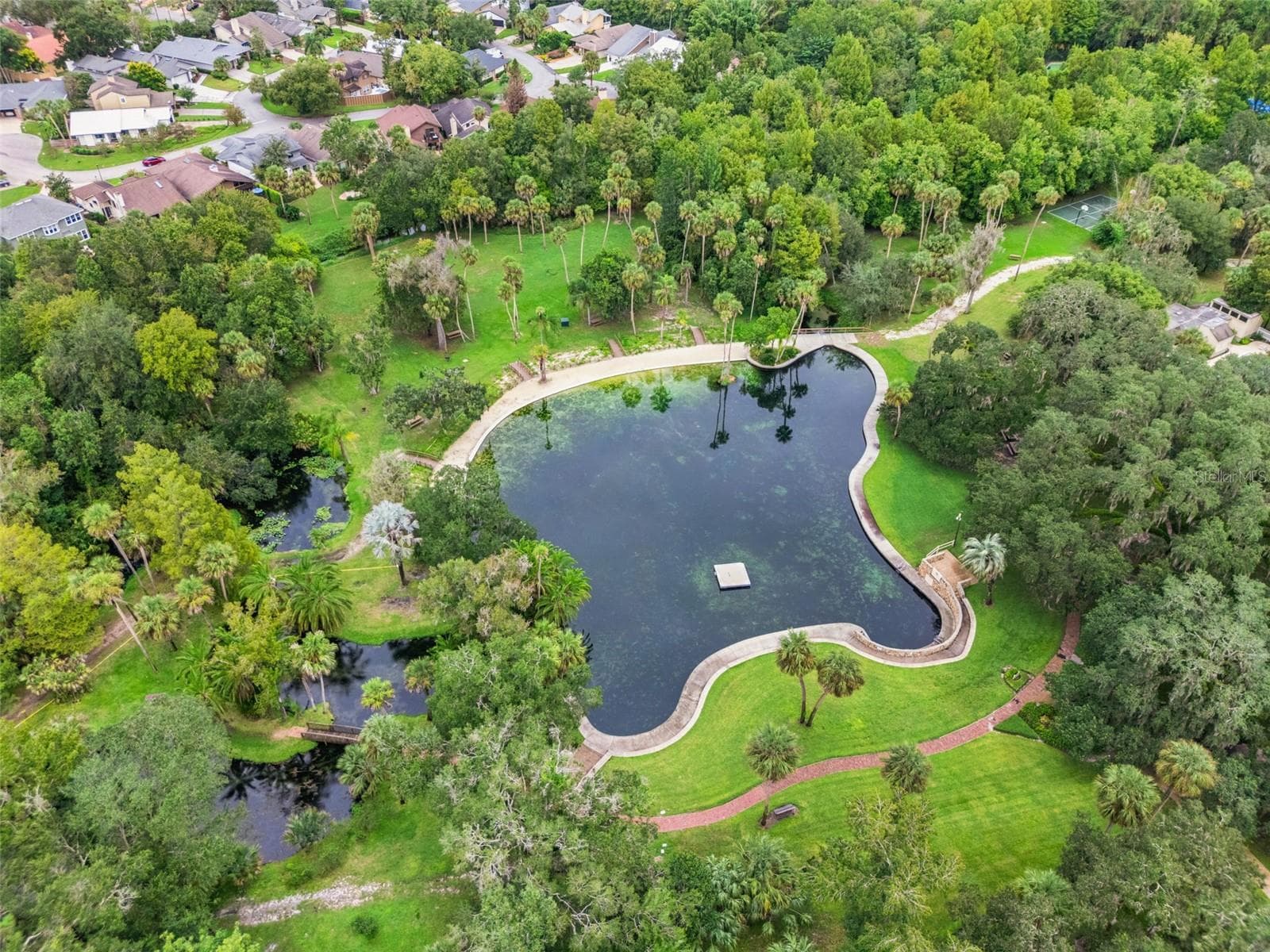 Natural springs, basket ball courts top right of photo, and community pool just to the right of the basketball courts. Yours to enjoy every day! - 221 PINE CONE LN, LONGWOOD