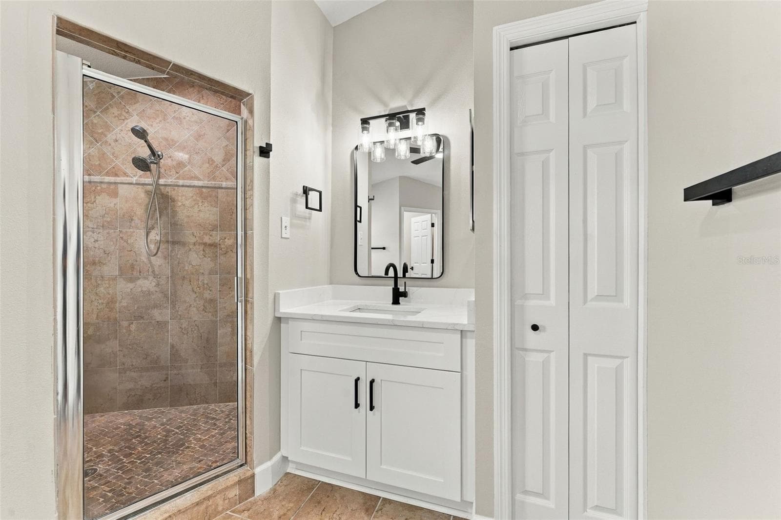 Linen closet in primary bathroom for additional storage - 10102 VISTA POINTE DR, TAMPA