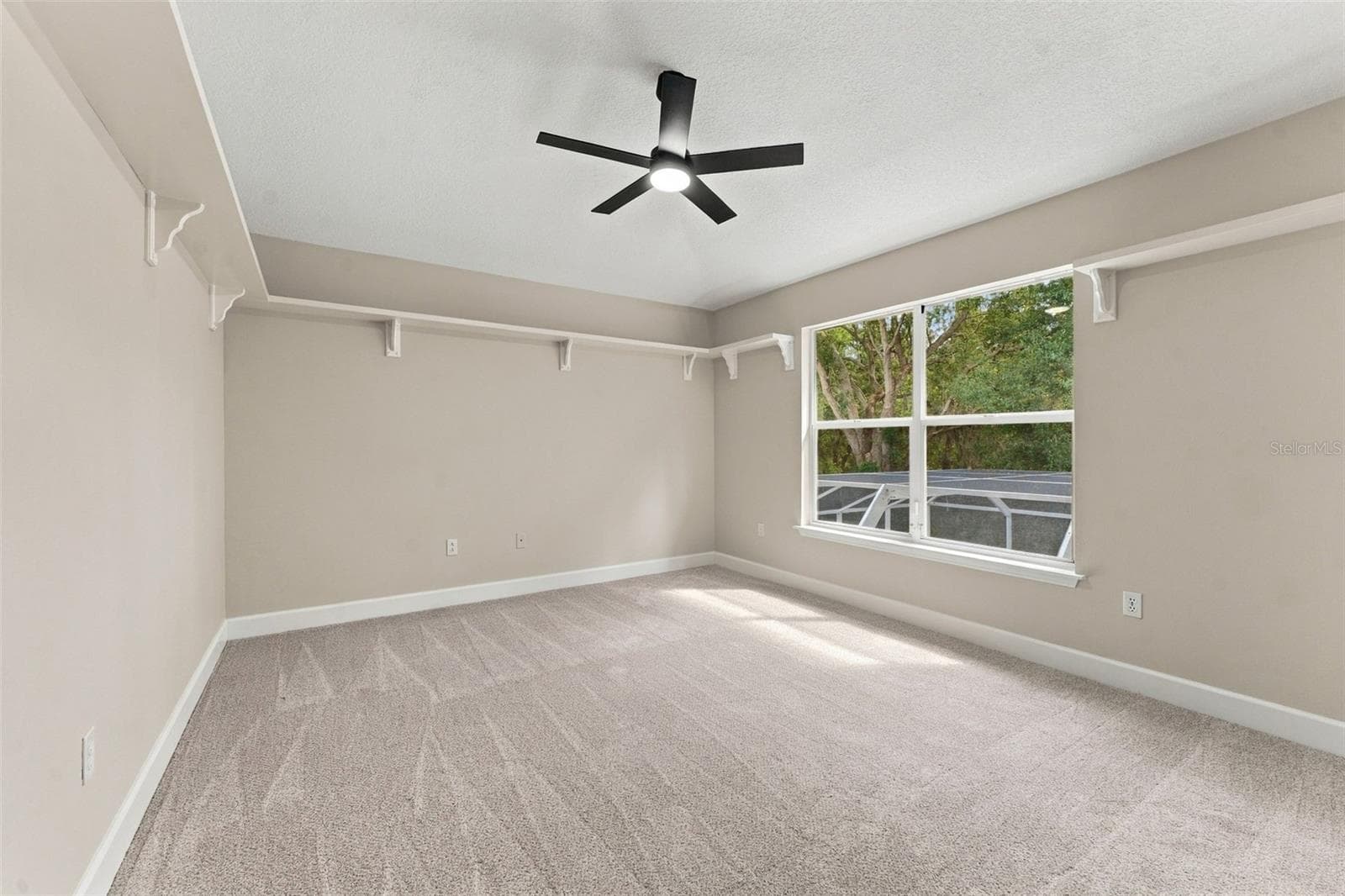 Bedroom 2 located upstairs overlooking the pool cage and woods - 10102 VISTA POINTE DR, TAMPA