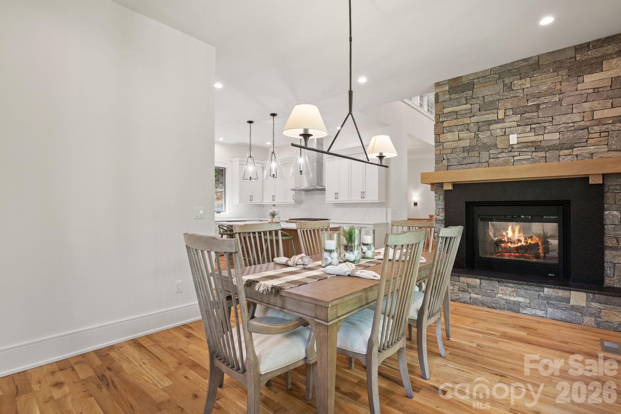 Dining room with see-through fireplace - 505 Barrington Drive, Asheville