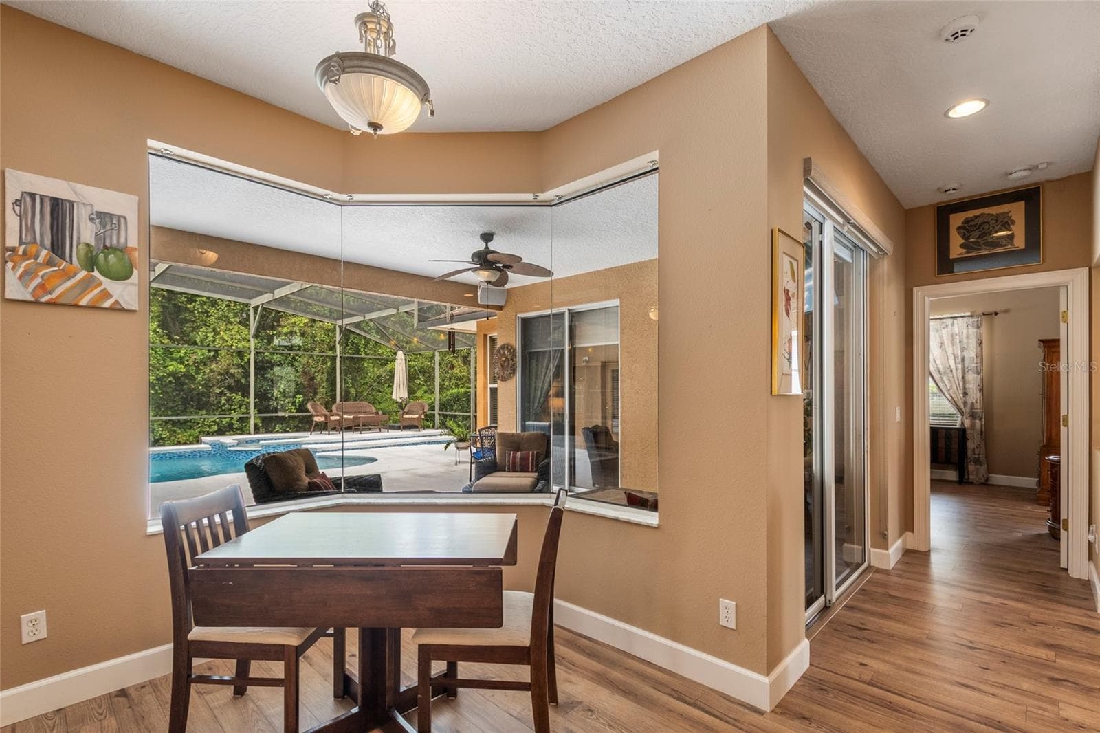Bay Window Breakfast Nook with breathtaking view of sparking pool, hot tub and lanai - 2712 ALOMA OAKS DR, OVIEDO