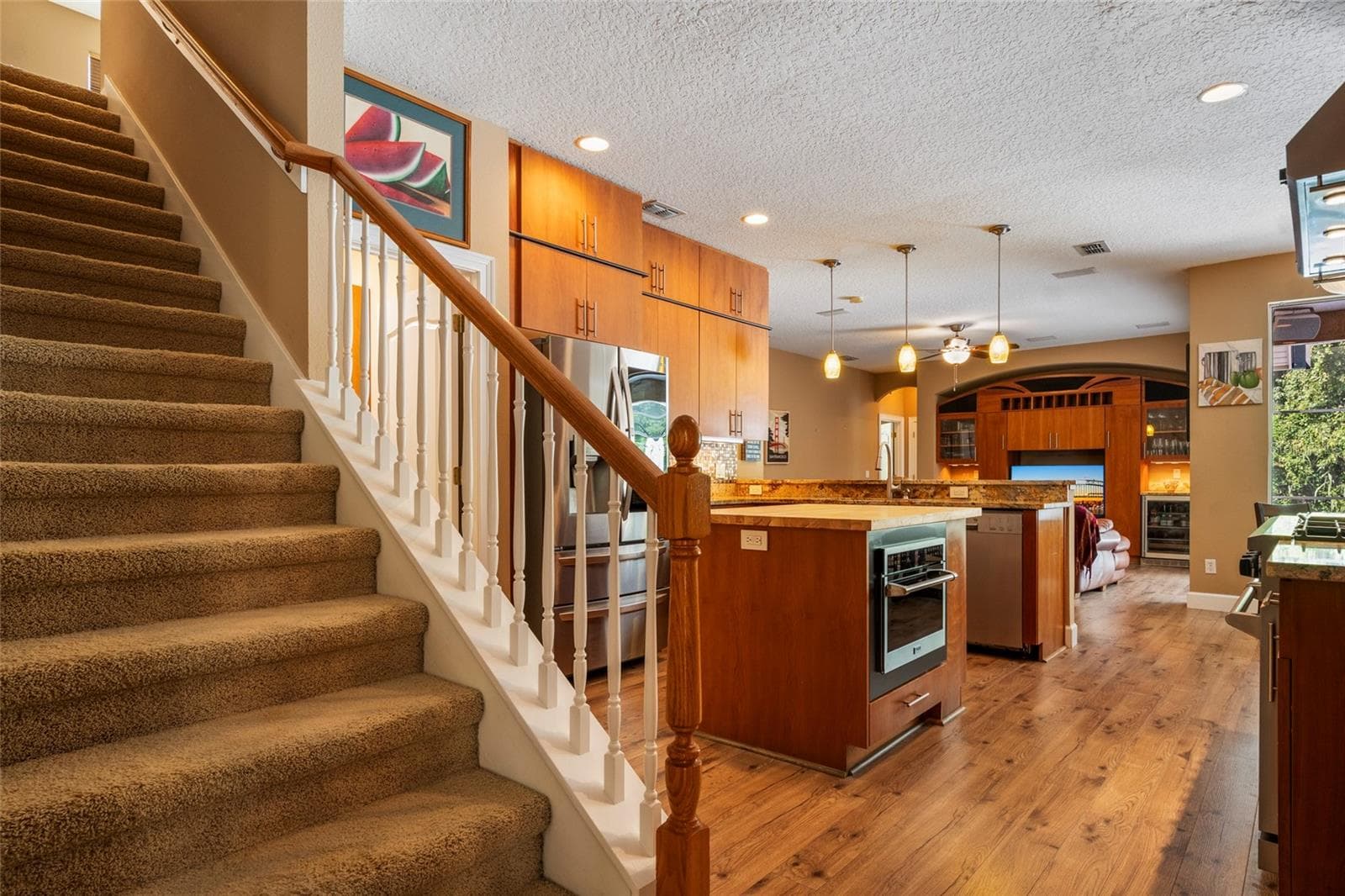 Stairs off Kitchen leading to upstairs Bonus Room - 2712 ALOMA OAKS DR, OVIEDO