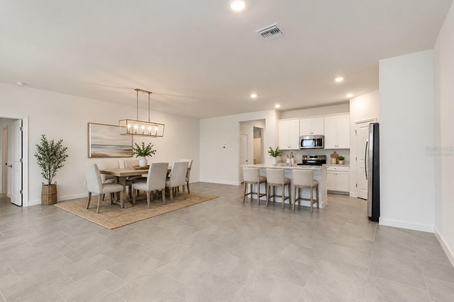 Virtually Staged Kitchen & Dining Room - 13320 GRASSMERE CT, PUNTA GORDA