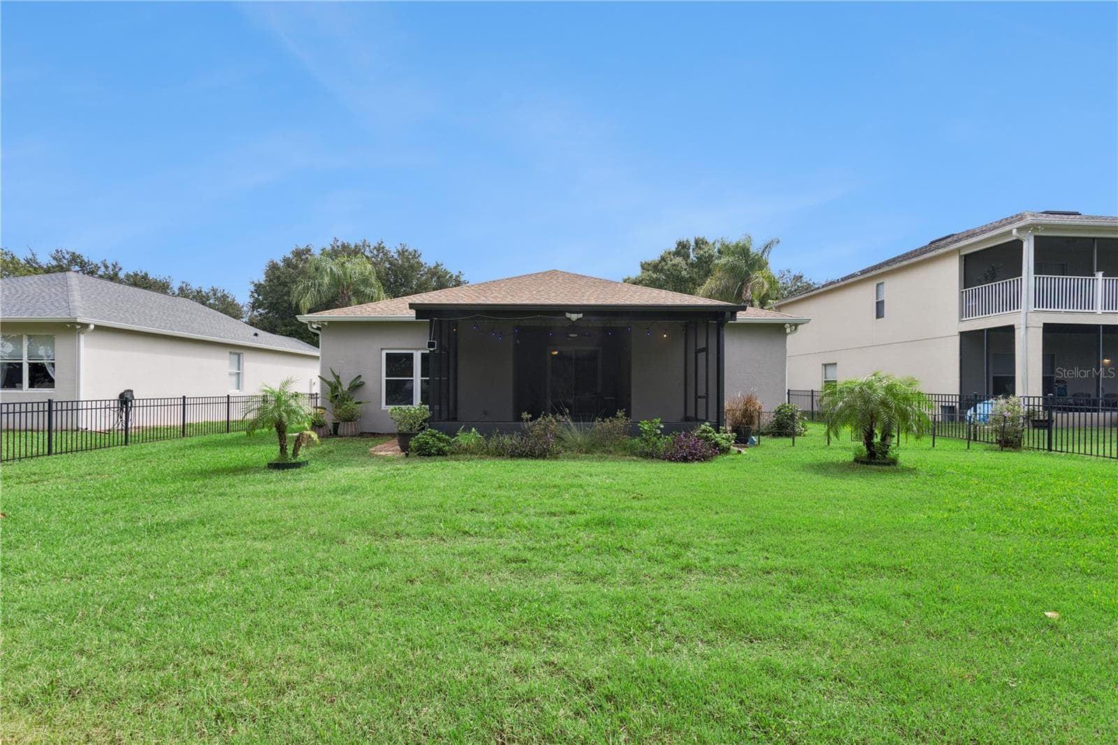 Rear View with Backyard - 5018 TEMPIC DR, MOUNT DORA