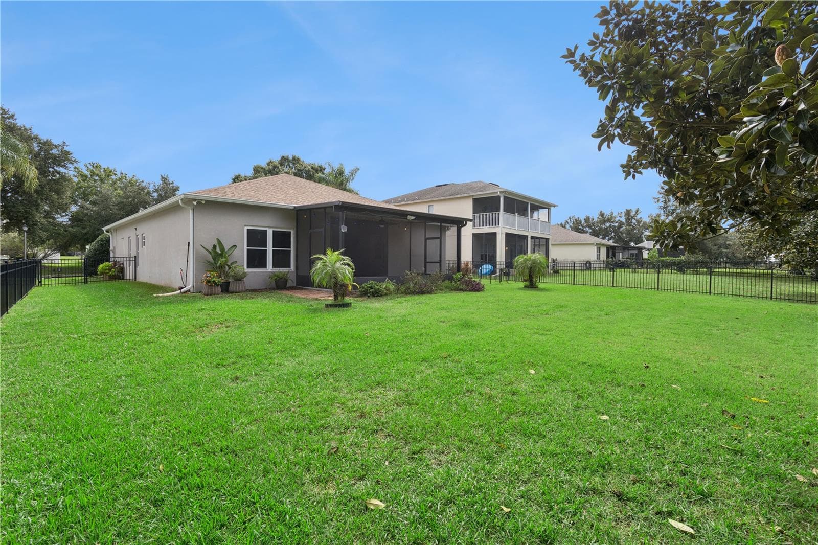 Rear View with Backyard - 5018 TEMPIC DR, MOUNT DORA