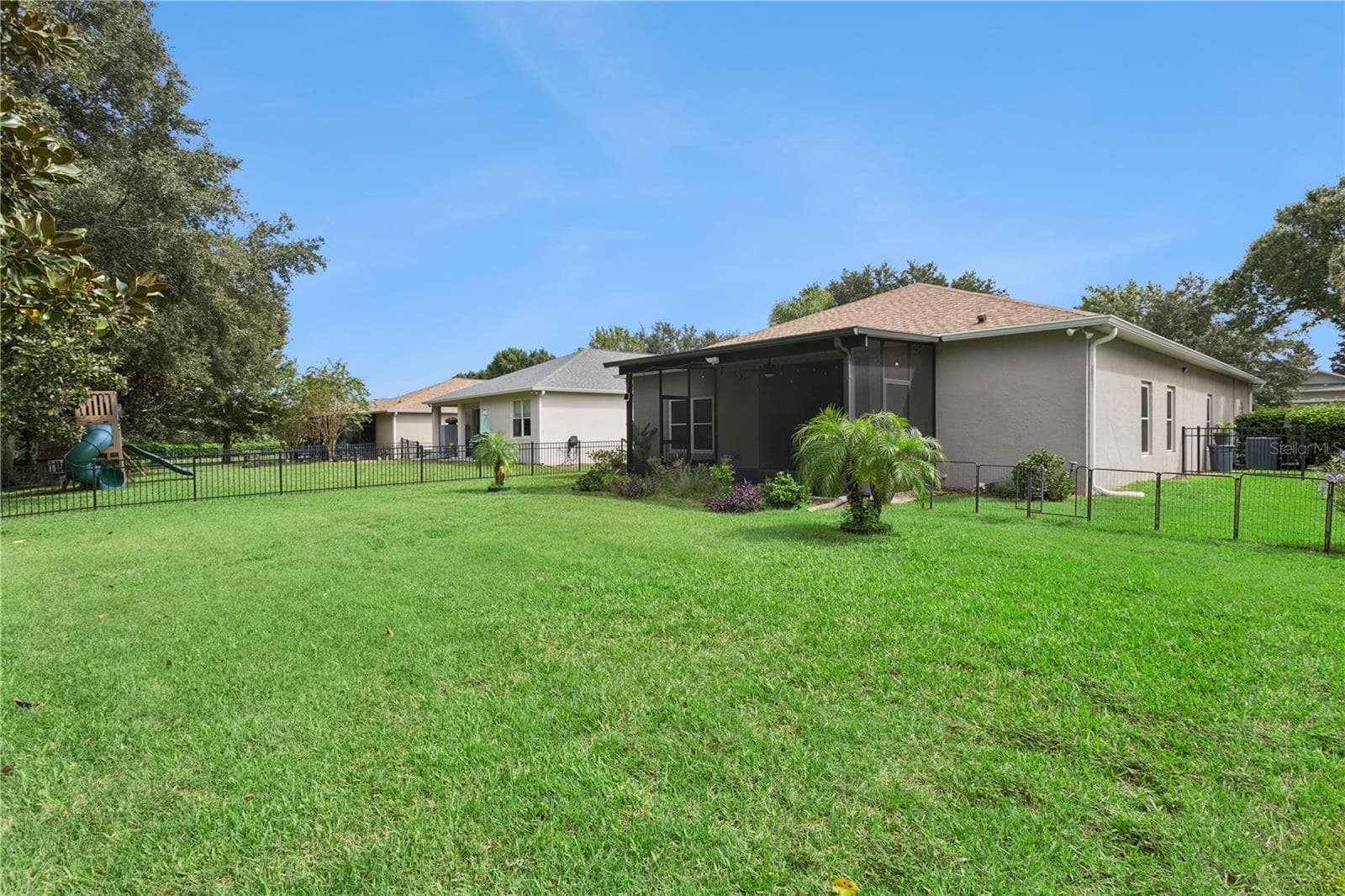 Rear View with Backyard - 5018 TEMPIC DR, MOUNT DORA