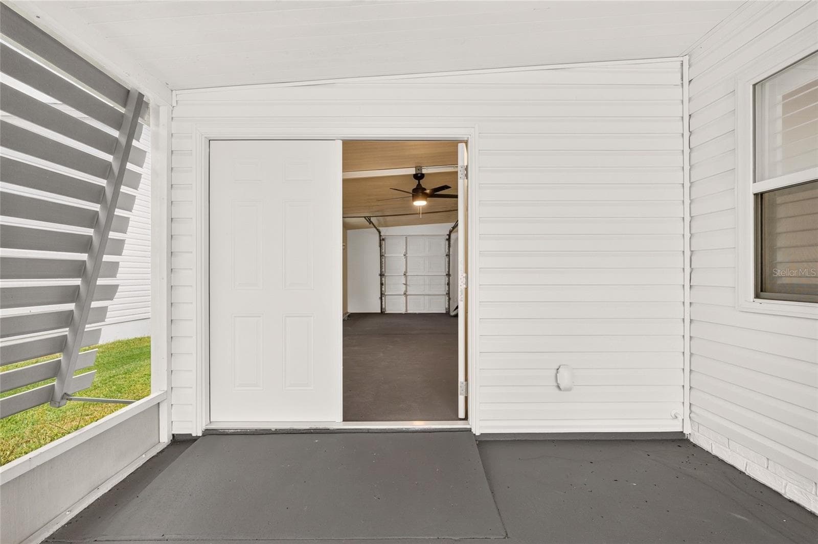 Screened Porch to Golf Cart Garage - 1124 DEL TORO DR, LADY LAKE