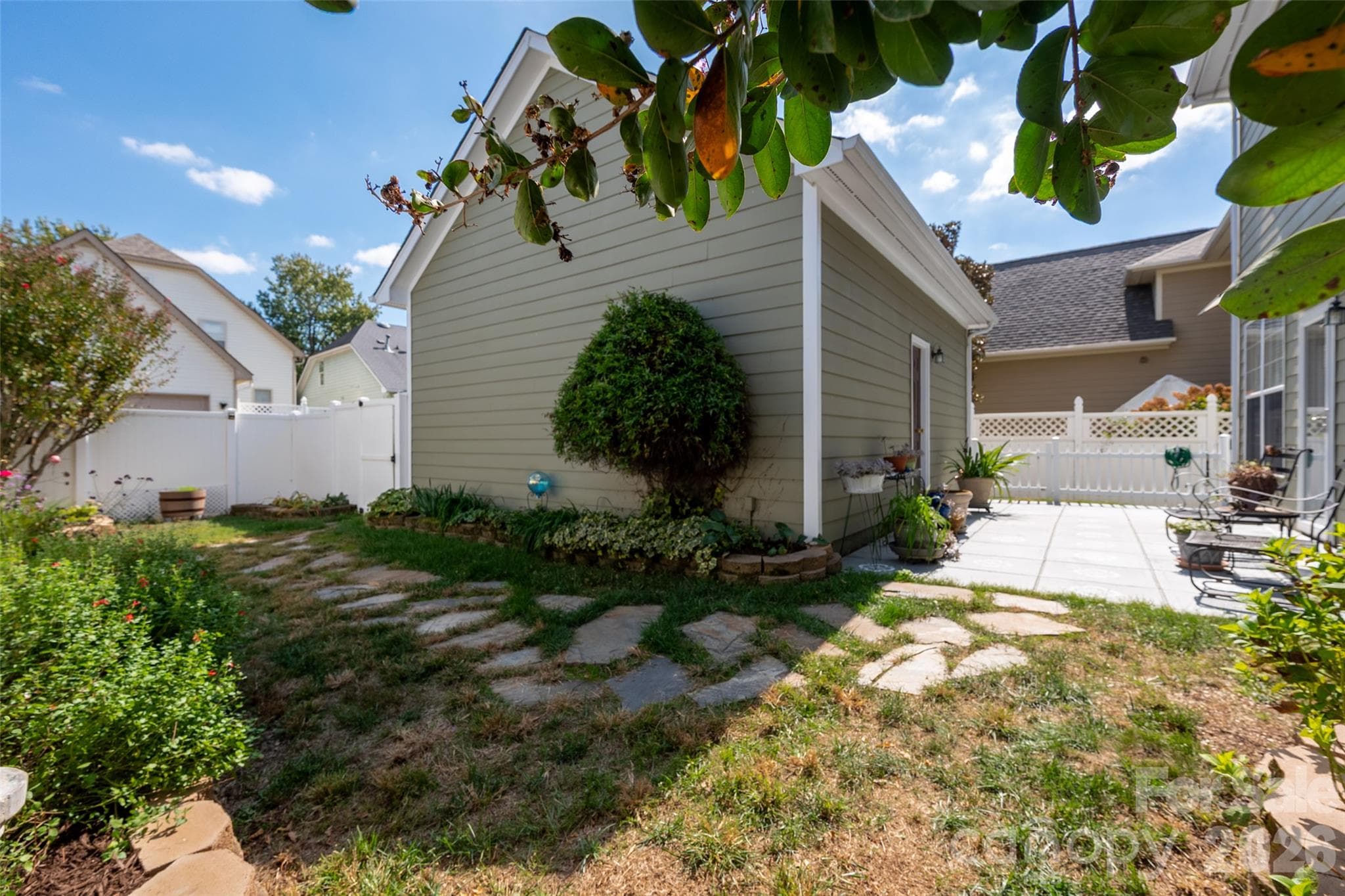 Tranquil back patio and yard with little maintenance. - 3004 Ivy Brook Place, Matthews