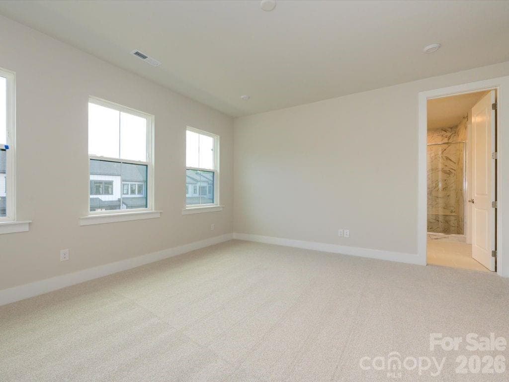 Primary Suite Featuring 9' Ceilings and 8' Doorways. - 217 Halemarg Drive, Belmont