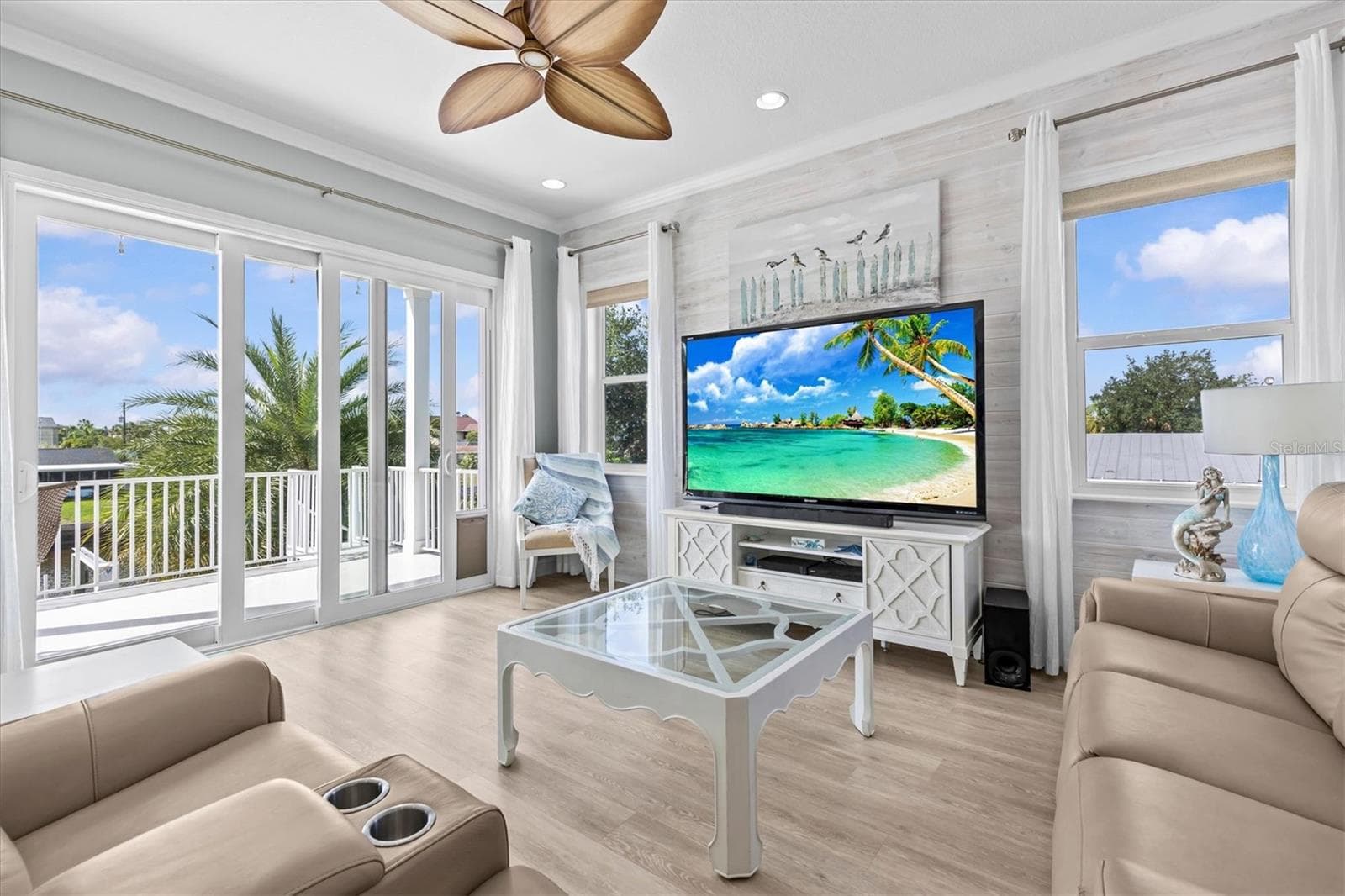 Living Room with Sliding Glass Doors to the Main Back Covered Deck - 4030 GULF COAST DR, HERNANDO BEACH