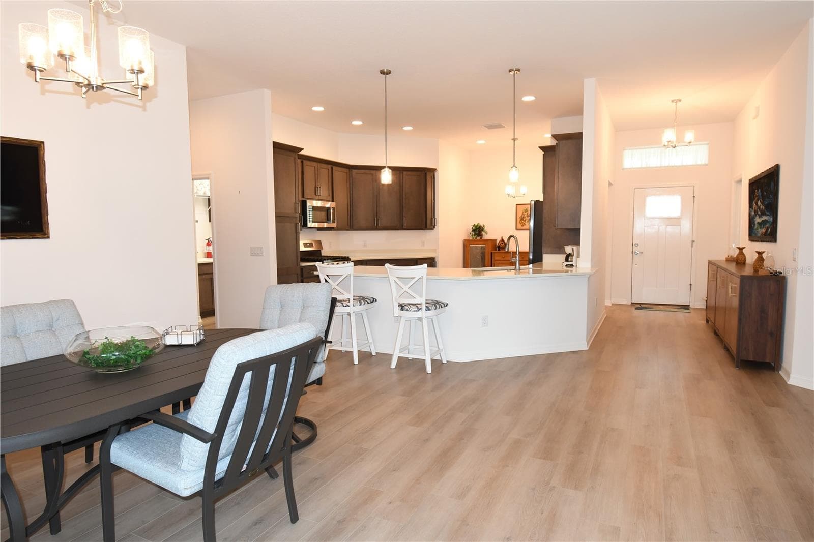 A View Of The Front Entrance & Dining - 4157 COLLERETTE CT, THE VILLAGES