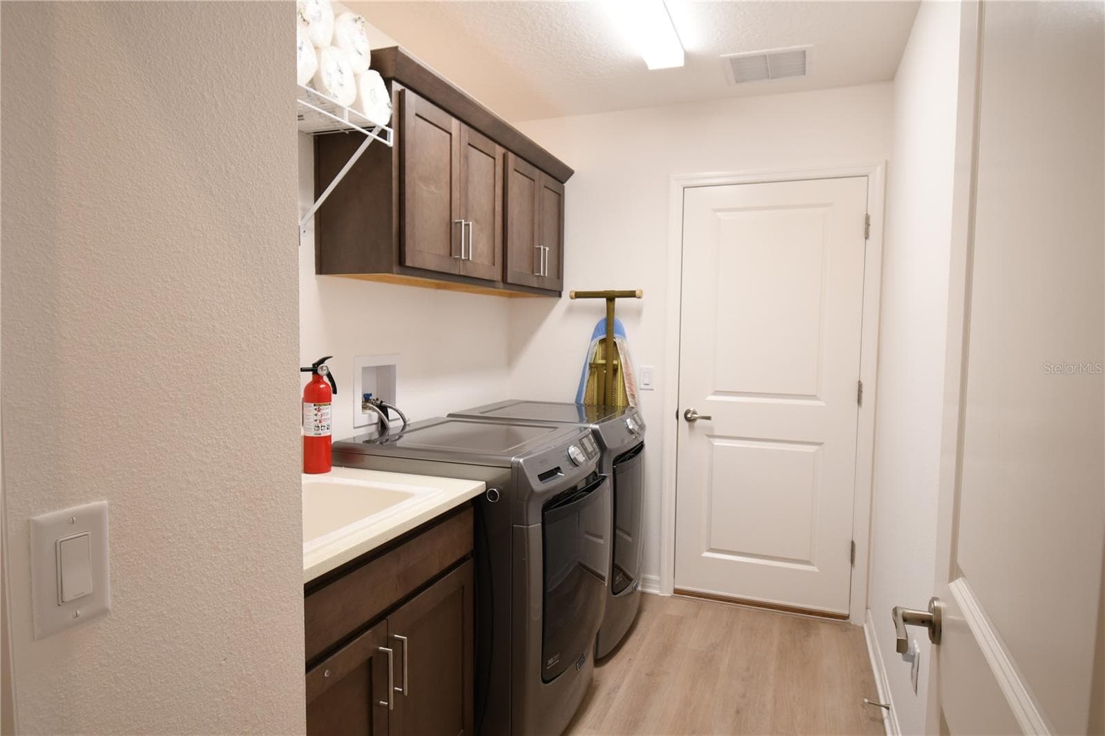 Laundry Room with Utility Sink and Added Cabinetry - 4157 COLLERETTE CT, THE VILLAGES