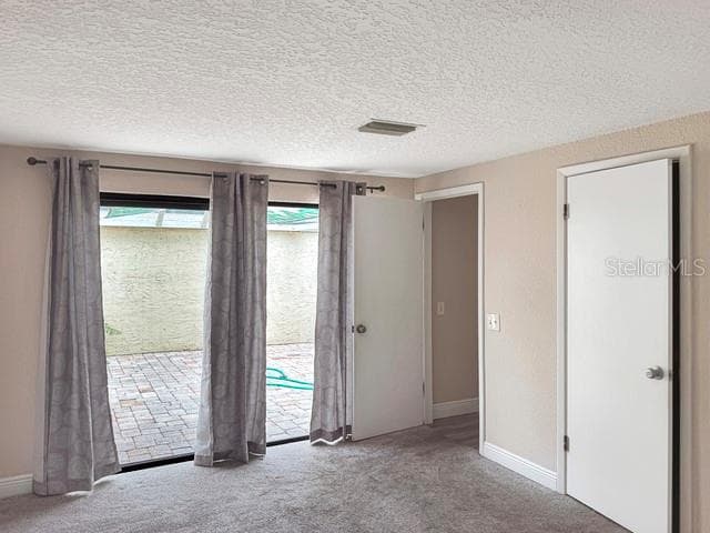 Primary Bedroom overlooks large screened patio - 12233 SADDLE STRAP ROW, HUDSON