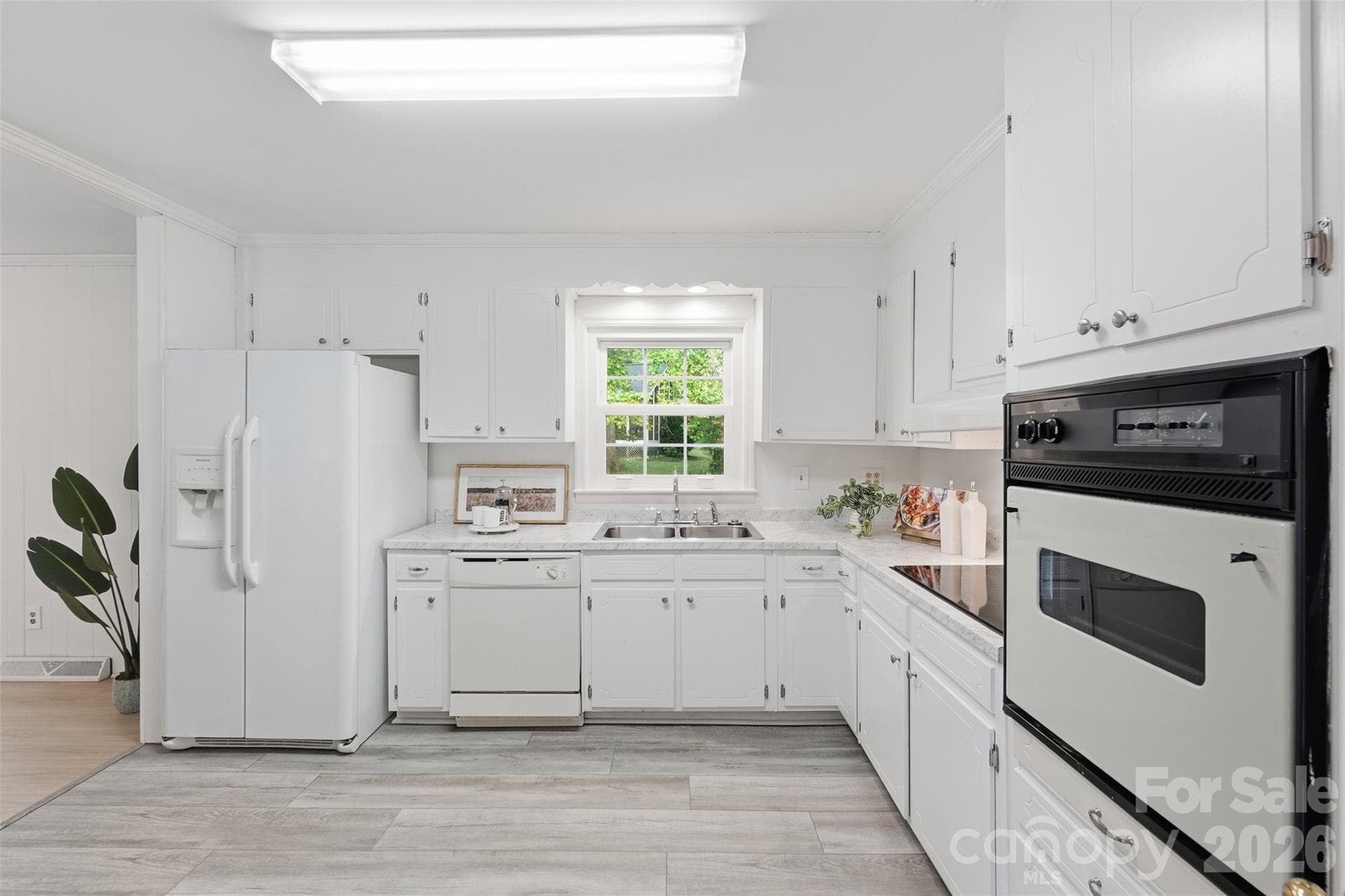 Bright Kitchen with window for view of the mature trees in the backyard - 5724 Telfair Road, Charlotte