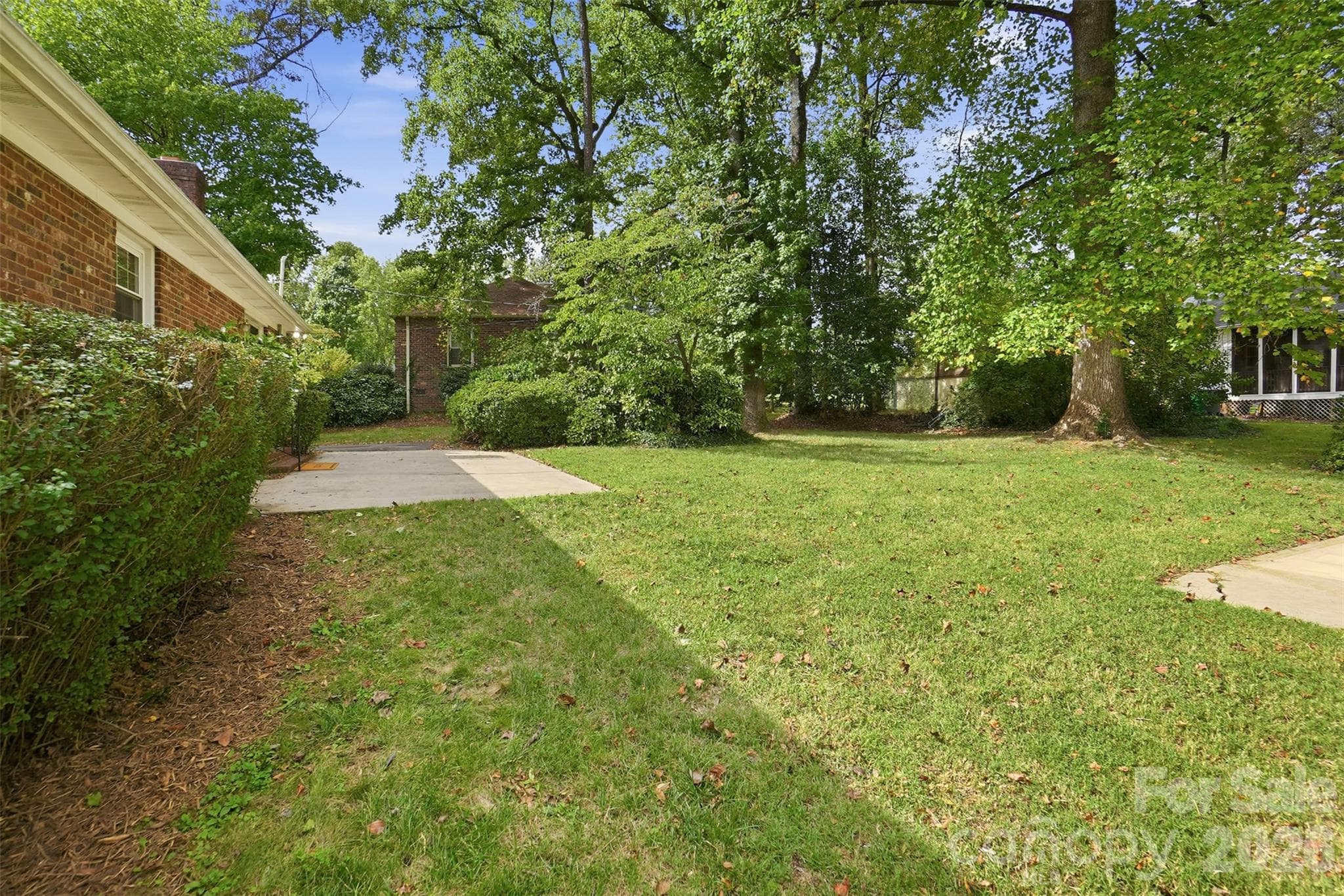Lush landscape with mature oak trees on 0.28 acres - 5724 Telfair Road, Charlotte