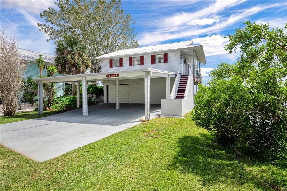 Covered carport and single car garage. Lots of room for your toys! - 12396 W Standish DR, HOMOSASSA FL 34448, Homosassa